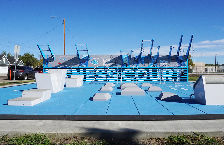 Blue outdoor excercise area with grey excercise areas