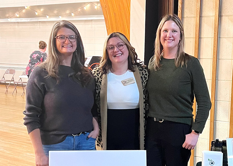 Sarah Swanson poses at Two Rivers Economic Growth event with Shyanne Wallace and Jennifer Robley